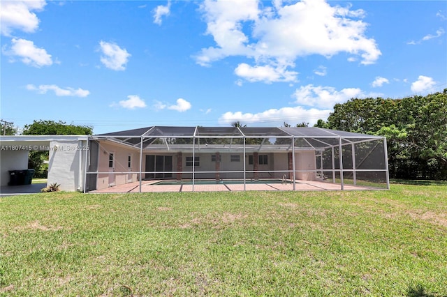 17535 SW 91st Ave, Palmetto Bay, FL 33157 - rear view of property featuring a lawn, a patio area, an outdoor pool, and a lanai