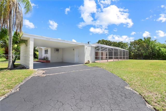 17535 SW 91st Ave, Palmetto Bay, FL 33157 - manufactured / mobile home featuring an attached carport, driveway, and a front lawn