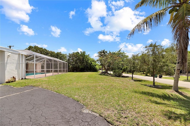 17535 SW 91st Ave, Palmetto Bay, FL 33157 - view of green lawn with a lanai and an outdoor pool