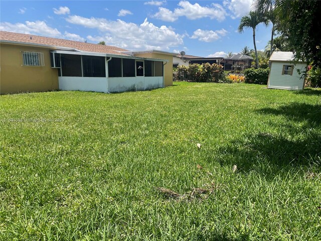 11753 SW 32nd St, Miami, FL 33175 - view of grassy yard with a sunroom