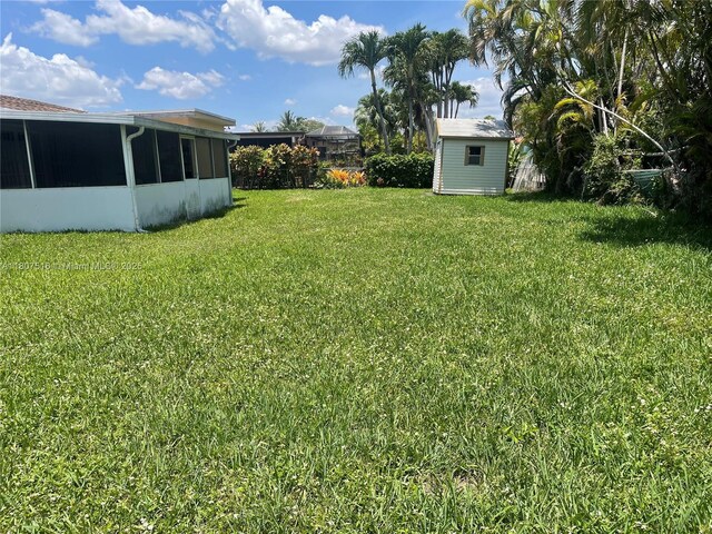 11753 SW 32nd St, Miami, FL 33175 - view of grassy yard featuring a sunroom