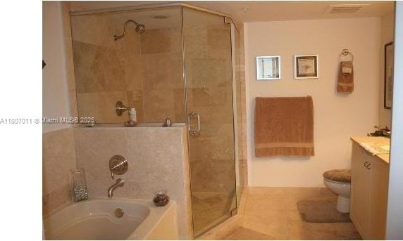 3232 SW 22nd Ter Unit 1003, Miami, FL 33145 - bathroom featuring a shower stall, a bath, vanity, and toilet