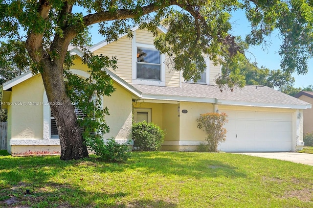 879 Matt Ln, Port Orange, FL 32127 - view of front facade featuring roof with shingles, a front yard, concrete driveway, a garage, and stucco siding