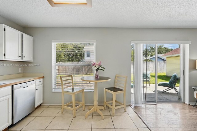 879 Matt Ln, Port Orange, FL 32127 - dining area with a textured ceiling and baseboards