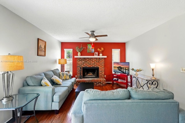 879 Matt Ln, Port Orange, FL 32127 - living room featuring a ceiling fan, wood finished floors, a textured ceiling, and a fireplace