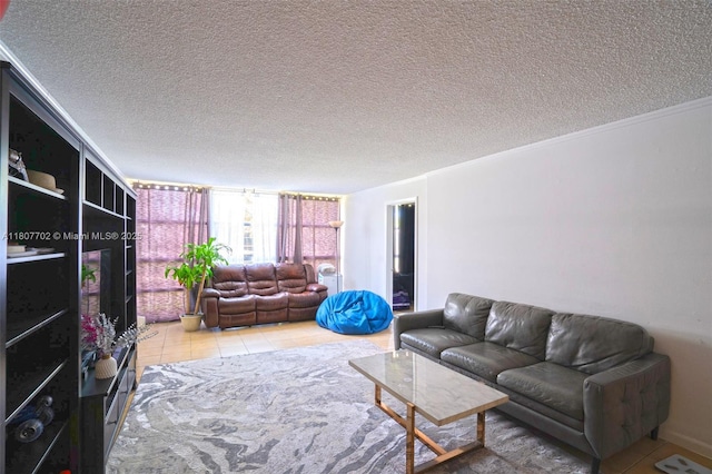 2101 Atlantic Shores Blvd Unit 120, Hallandale Beach, FL 33009 - tiled living room featuring a textured ceiling