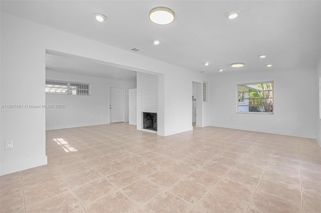 9710 Haitian Dr, Cutler Bay, FL 33189 - unfurnished living room featuring a fireplace, recessed lighting, light tile patterned floors, and baseboards