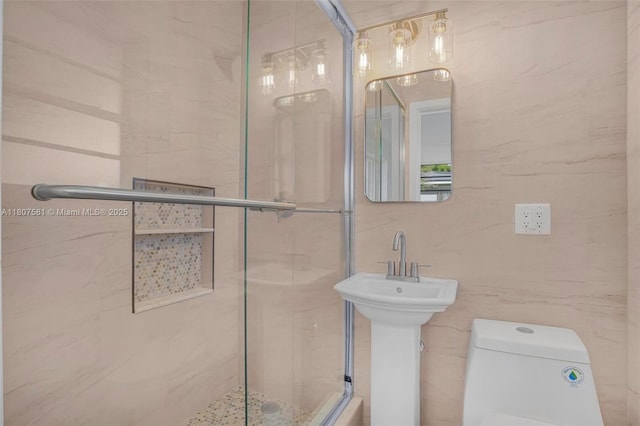 9710 Haitian Dr, Cutler Bay, FL 33189 - bathroom featuring a shower stall, toilet, tile walls, and a sink