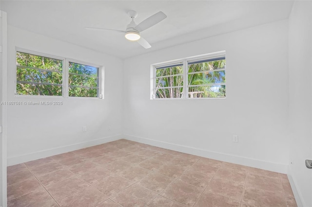 9710 Haitian Dr, Cutler Bay, FL 33189 - spare room with baseboards and a ceiling fan