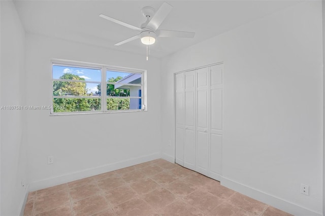 9710 Haitian Dr, Cutler Bay, FL 33189 - unfurnished bedroom featuring baseboards, a closet, and a ceiling fan