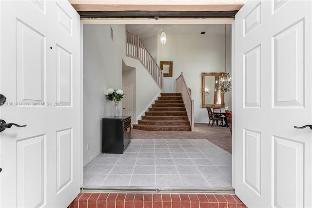 13366 NW 14th St, Pembroke Pines, FL 33028 - stairs featuring a chandelier, carpet, tile patterned floors, and baseboards