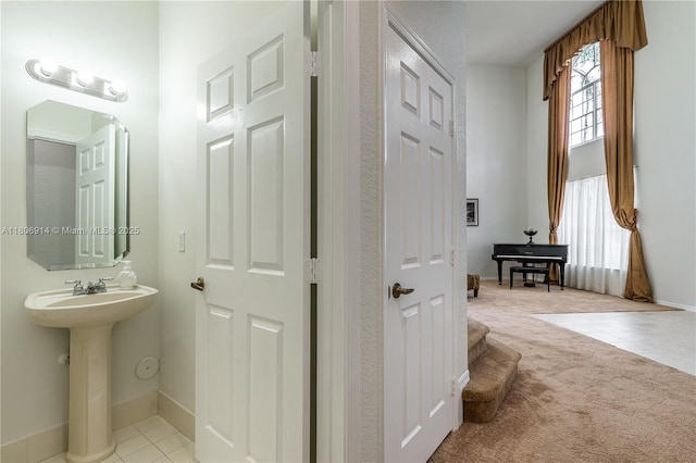 13366 NW 14th St, Pembroke Pines, FL 33028 - bathroom featuring tile patterned flooring, baseboards, and a sink