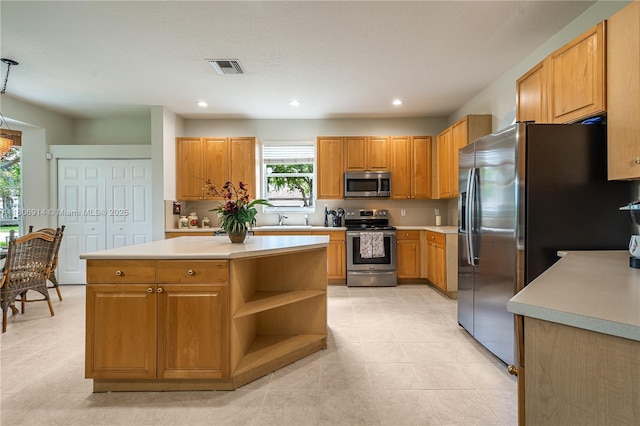 13366 NW 14th St, Pembroke Pines, FL 33028 - kitchen featuring stainless steel appliances, light countertops, open shelves, recessed lighting, and a kitchen island