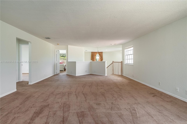 13366 NW 14th St, Pembroke Pines, FL 33028 - carpeted empty room with healthy amount of natural light, baseboards, and a textured ceiling