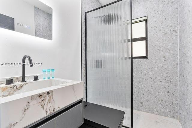 4861 SW 5th St, Miami, FL 33134 - bathroom with a walk in shower and vanity
