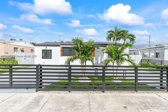 4861 SW 5th St, Miami, FL 33134 - view of front of house with a fenced front yard and a tiled roof