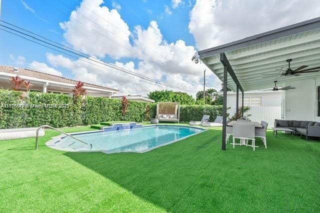 4861 SW 5th St, Miami, FL 33134 - view of swimming pool with an outdoor hangout area, a lawn, and ceiling fan