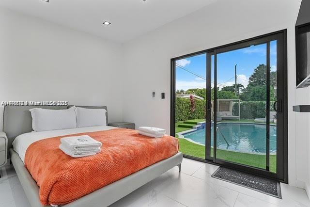 4861 SW 5th St, Miami, FL 33134 - bedroom with access to outside, light marble finish flooring, and recessed lighting