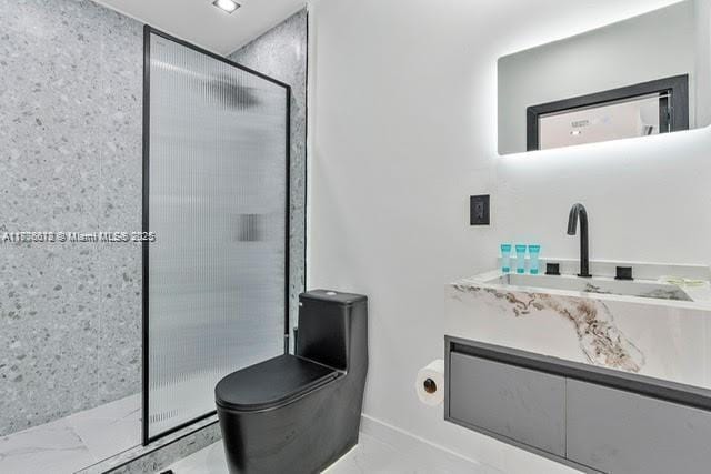 4861 SW 5th St, Miami, FL 33134 - full bath featuring a shower stall, toilet, vanity, and marble look tile flooring