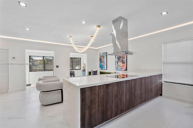 4861 SW 5th St, Miami, FL 33134 - kitchen with island exhaust hood, modern cabinets, black electric cooktop, a peninsula, and light countertops