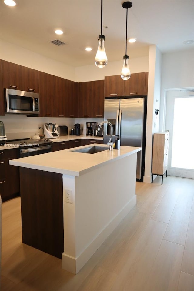 8201 NW 41st St Unit D-402, Doral, FL 33166 - kitchen featuring stainless steel appliances, a sink, light countertops, modern cabinets, and recessed lighting