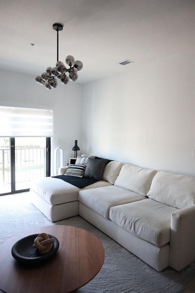 8201 NW 41st St Unit D-402, Doral, FL 33166 - carpeted living room with a chandelier