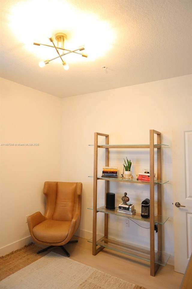 8201 NW 41st St Unit D-402, Doral, FL 33166 - sitting room with a chandelier and baseboards
