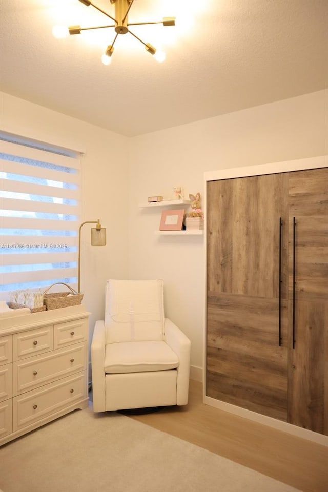 8201 NW 41st St Unit D-402, Doral, FL 33166 - living area with a chandelier and light wood-style floors