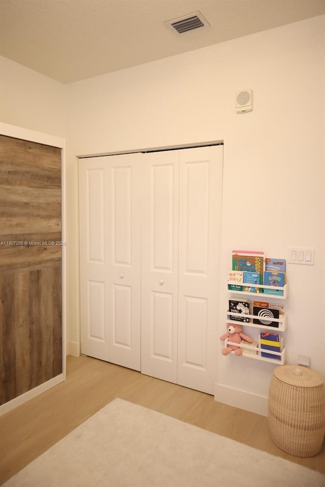 8201 NW 41st St Unit D-402, Doral, FL 33166 - bedroom with wood finished floors and a closet