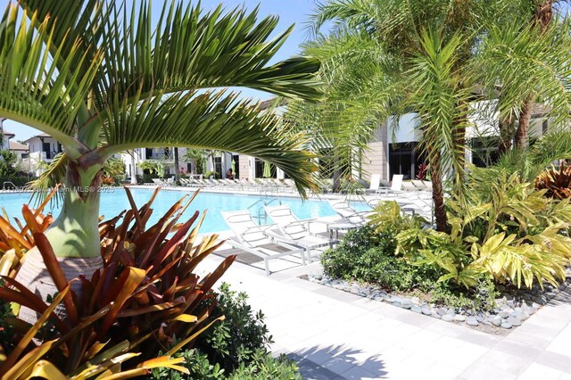 8201 NW 41st St Unit D-402, Doral, FL 33166 - community pool with a patio area