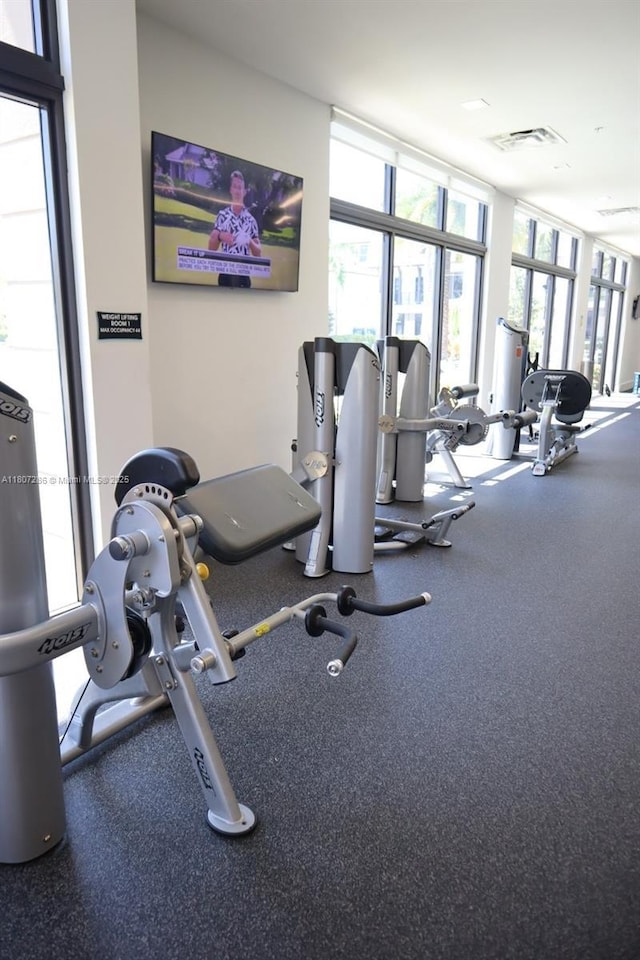 8201 NW 41st St Unit D-402, Doral, FL 33166 - exercise room with a wall of windows