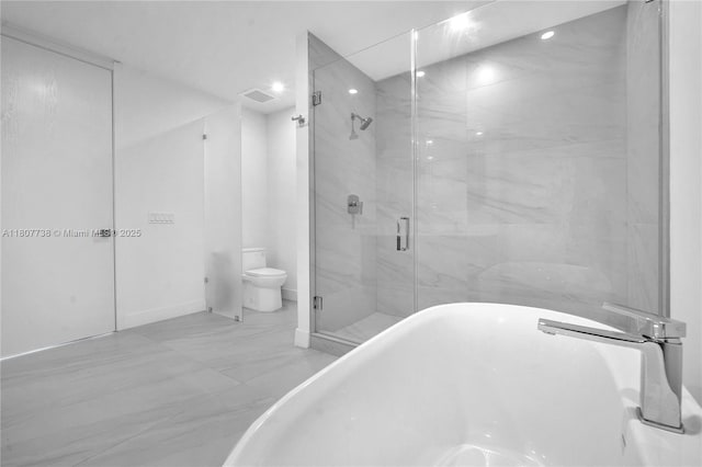 17550 Collins Ave Unit 603, Sunny Isles Beach, FL 33160 - bathroom featuring marble finish flooring, a stall shower, a soaking tub, toilet, and recessed lighting