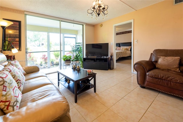 9823 S Hollybrook Lake Dr Unit 105, Pembroke Pines, FL 33025 - living room with a chandelier, light tile patterned floors, expansive windows, and a textured ceiling