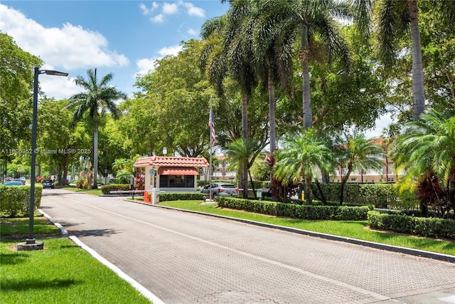 9823 S Hollybrook Lake Dr Unit 105, Pembroke Pines, FL 33025 - view of street featuring curbs and street lights