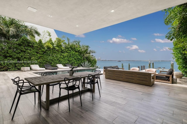 1379 N Venetian Way, Miami, FL 33139 - view of patio with outdoor lounge area, a water view, and outdoor dining area
