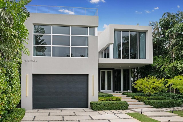 1379 N Venetian Way, Miami, FL 33139 - contemporary home with stucco siding, french doors, and a garage