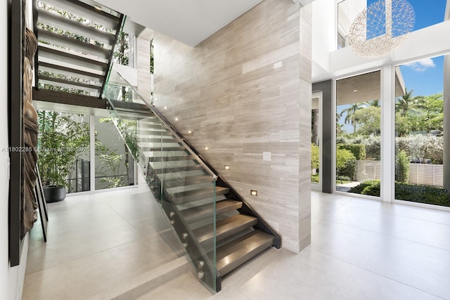 1379 N Venetian Way, Miami, FL 33139 - staircase with a towering ceiling and finished concrete floors