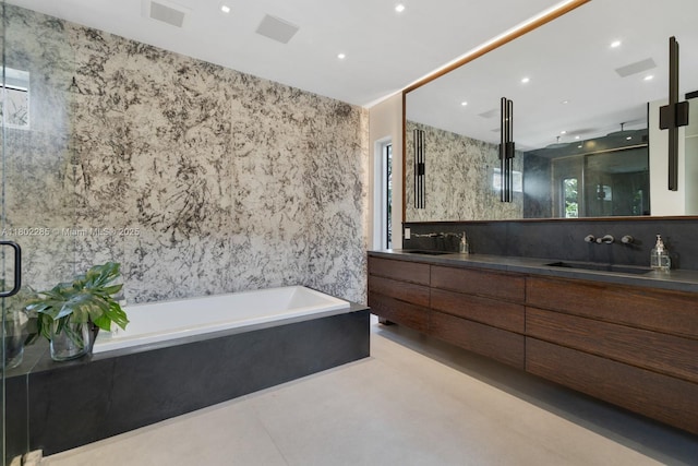 1379 N Venetian Way, Miami, FL 33139 - bathroom featuring double vanity, a garden tub, a stall shower, healthy amount of natural light, and tile walls