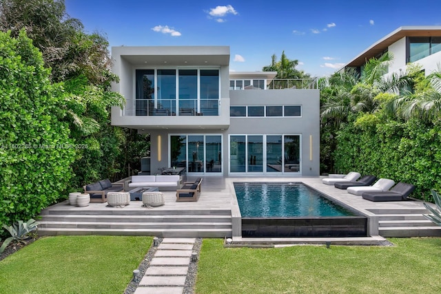 1379 N Venetian Way, Miami, FL 33139 - back of property featuring an outdoor living space, a balcony, stucco siding, and a lawn