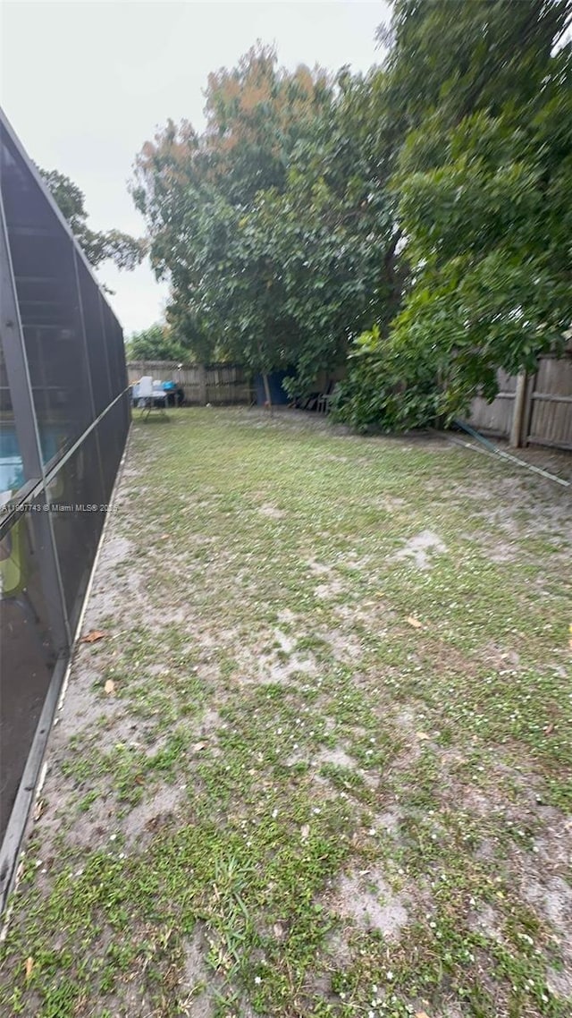 2301 NW 43rd Ter, Lauderhill, FL 33313 - fenced backyard featuring glass enclosure