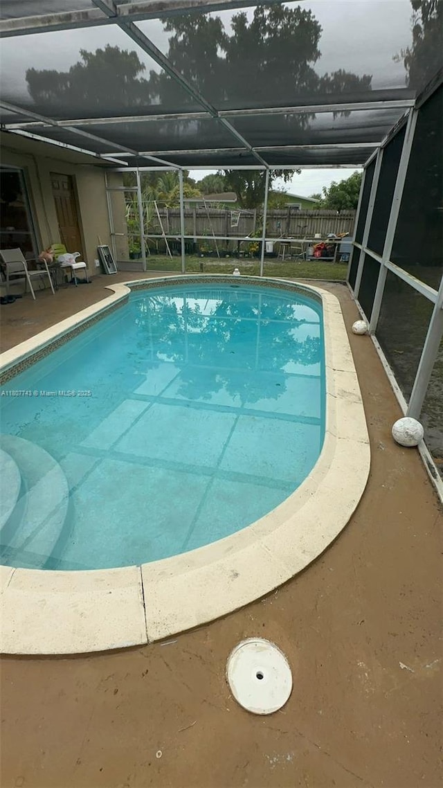 2301 NW 43rd Ter, Lauderhill, FL 33313 - view of swimming pool with a fenced backyard, a lanai, and a patio