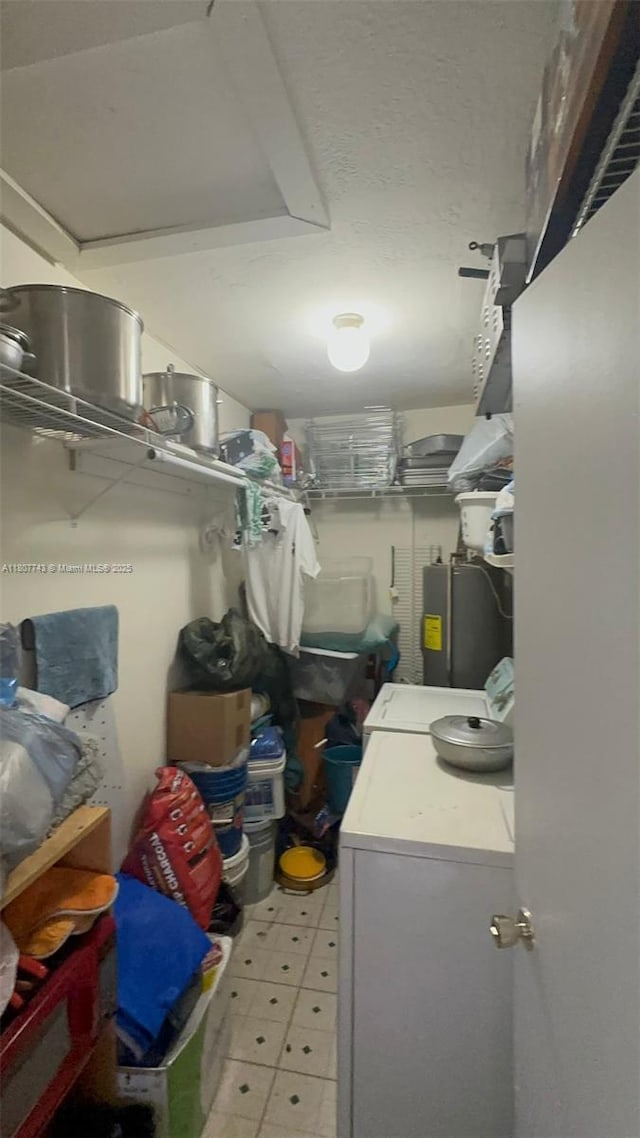 2301 NW 43rd Ter, Lauderhill, FL 33313 - storage area with washer and clothes dryer and electric water heater