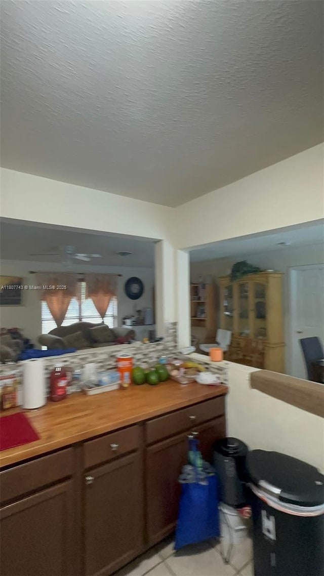 2301 NW 43rd Ter, Lauderhill, FL 33313 - bar area featuring a textured ceiling