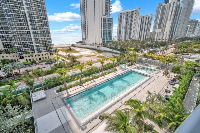 17550 Collins Ave Unit 704, Sunny Isles Beach, FL 33160 - community pool with a city view, a water view, and a patio
