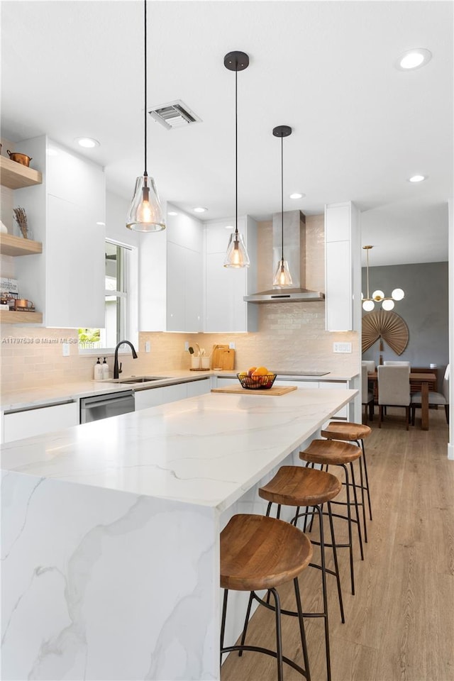 4017 W Gardenia Ave, Weston, FL 33332 - kitchen with wall chimney range hood, modern cabinets, white cabinets, and recessed lighting
