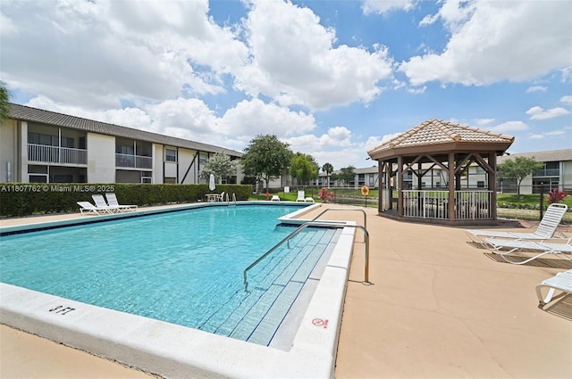 2391 NW 89th Dr Unit 409, Coral Springs, FL 33065 - community pool featuring a gazebo and a patio