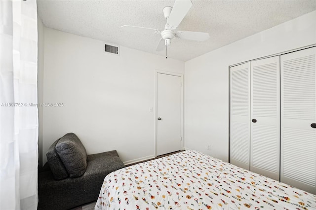 2391 NW 89th Dr Unit 409, Coral Springs, FL 33065 - bedroom featuring a textured ceiling, a closet, and a ceiling fan