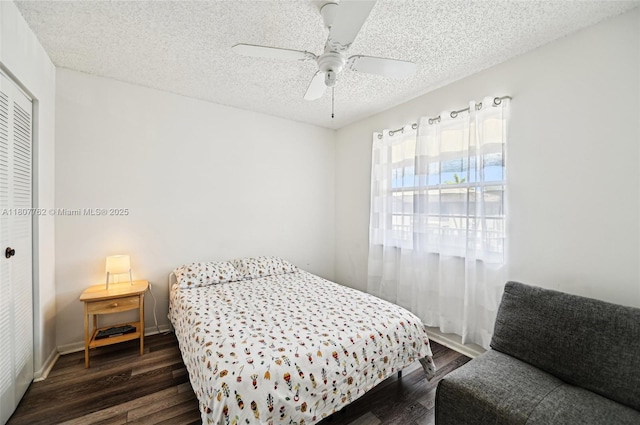 2391 NW 89th Dr Unit 409, Coral Springs, FL 33065 - bedroom with dark wood finished floors, a closet, a textured ceiling, and a ceiling fan