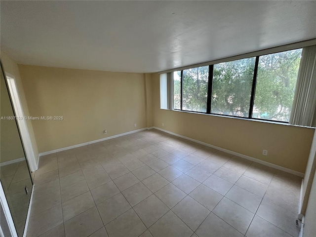4222 Inverrary Blvd Unit 4211, Lauderhill, FL 33319 - tiled spare room with baseboards