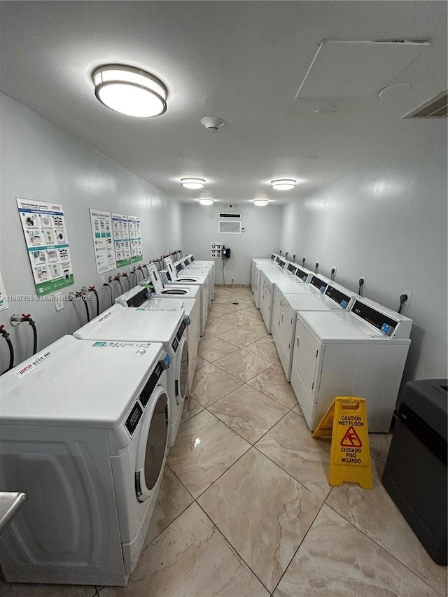 4222 Inverrary Blvd Unit 4211, Lauderhill, FL 33319 - community laundry featuring independent washer and dryer and light marble finish flooring